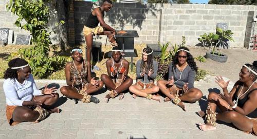a group of women sitting on the ground at Jayla Homestay in Maun