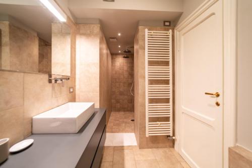 a bathroom with a sink and a toilet in it at Luxury Apartment Brera - Centro in Milan