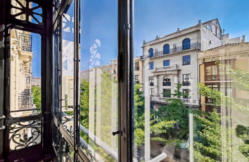 a view from a window of a building at Palacio Gran Vía, a Royal Hideaway Hotel in Granada
