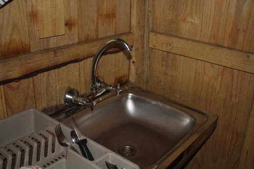 a kitchen sink with a faucet over it at Isikhoma-Khoma in Hilton