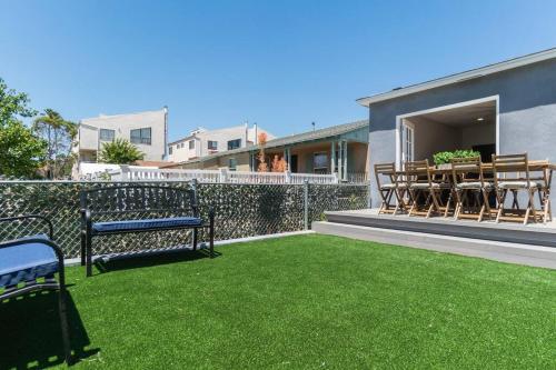 a balcony with a bench and a table and chairs at A Place to Create Lasting Family Memories in San Diego