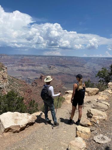 two people standing on the edge of the grand canyon at The Grand Canyon Headquarters in Valle