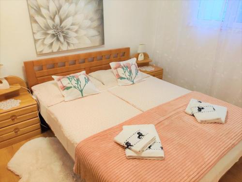 a bedroom with two beds with towels on them at Apartment Marina in Marina