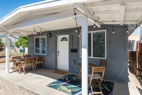 awning over a table and chairs on a patio at Urban Oasis: San Diego Bungalow Escape in San Diego
