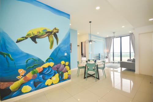 a living room with a painting of a sea turtle at D'Pristine Theme Suite by Nest Home at LEGOLAND in Nusajaya