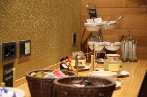 a counter top with baskets of food on it at Gästehaus by Stoos Hotels in Stoos