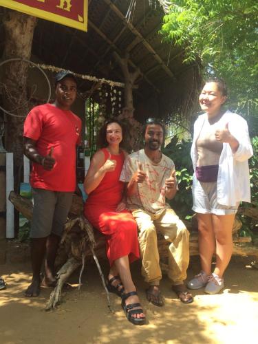 a group of people posing for a picture at Beach Bungalow Yala in Kirinda