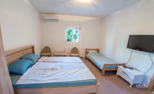 Cama o camas de una habitación en Apartments Fusion