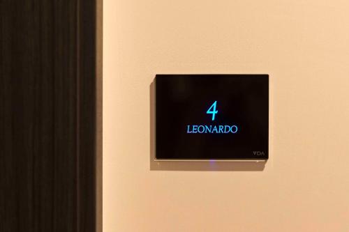 a lightswitch on a wall with a sign on it at Boutique Hotel Sirmione in Sirmione