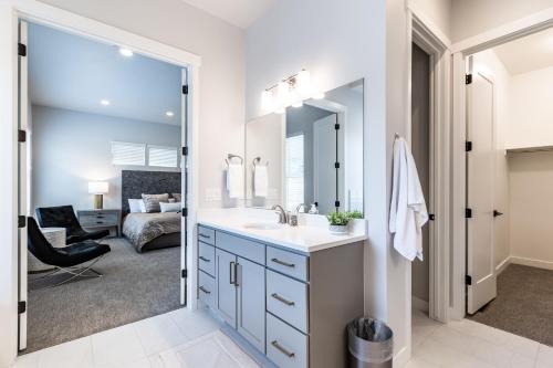 a bathroom with a sink and a mirror at Modern Mountain Retreat in Keetley