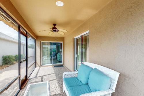 a living room with a couch and a ceiling fan at The Cove House in Wildwood