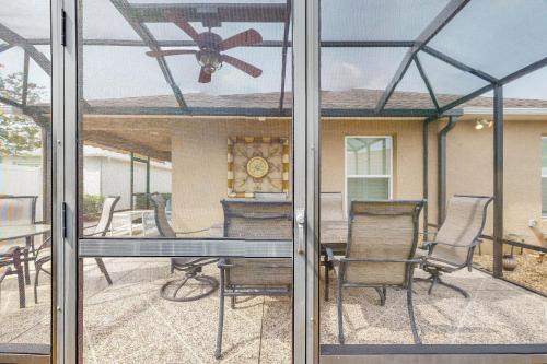 a screened in porch with a table and chairs at The Cove House in Wildwood