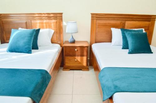 Katil atau katil-katil dalam bilik di PARADISE DESTINATIONS APARTMENT