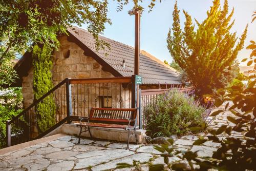 a bench sitting in front of a building at Grand Vista Boutique Hotel And Spa in Yuval
