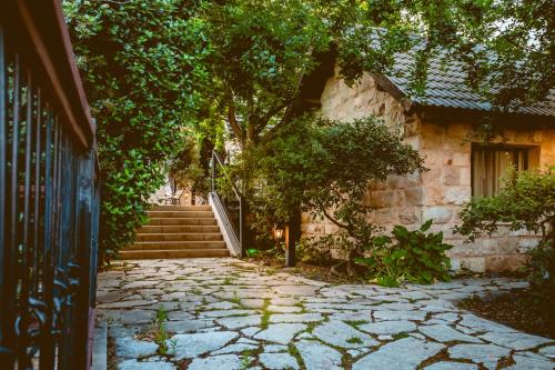 a stone walkway in front of a house with stairs at Grand Vista Boutique Hotel And Spa in Yuval