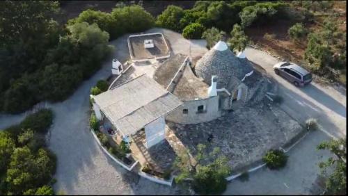 an aerial view of a house in the middle of a river at Trullo Ada in Ceglie Messapica