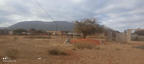 a view of a desert with a mountain in the background at Nakedi Accommodation Services in Burgersfort