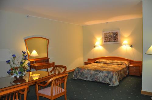 Кровать или кровати в номере Гостиница Западная
