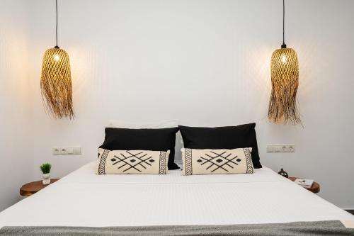 Ένα ή περισσότερα κρεβάτια σε δωμάτιο στο Nymphée Luxury Villas