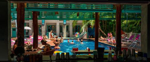 a group of people in a pool at a resort at Nomads Ao Nang in Ao Nang Beach