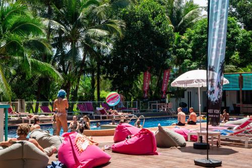 a group of people sitting in a swimming pool at Nomads Ao Nang in Ao Nang Beach