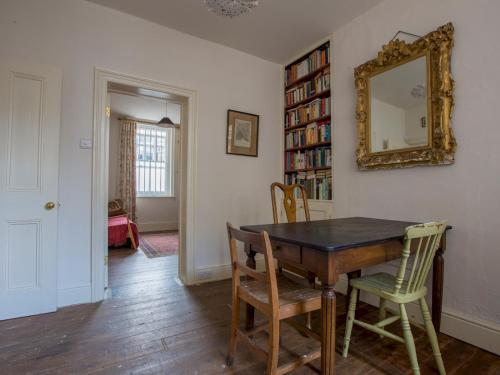 a dining room with a table and chairs and a mirror at Pass the Keys - Unique historical flat in the hart of London, South Bank in London