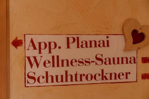 a sign on a wall that saysap plana wellness samurai schmutzer at Apparthaus Taxegger in Haus im Ennstal