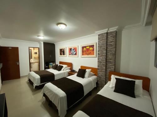 Postel nebo postele na pokoji v ubytování Hotel D' Leon