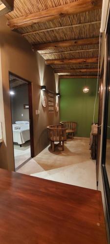 a room with a ping pong table and a mirror at Hotel Tulmas in Tilcara