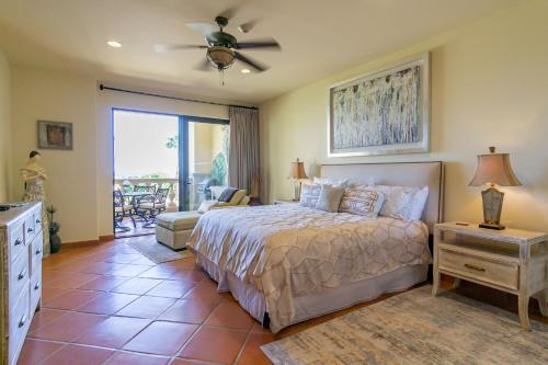 a bedroom with a bed and a living room at Luxury retreat in Cabo del Sol golf and beach community in Cabo San Lucas