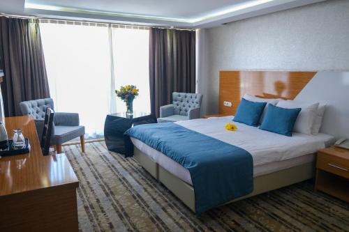 Postel nebo postele na pokoji v ubytování Bulvar Hotel