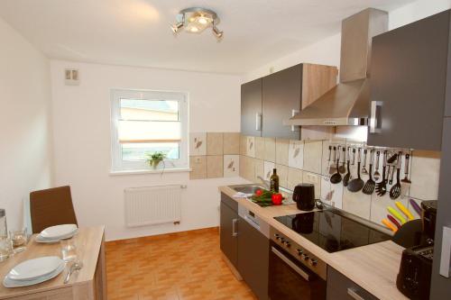 a kitchen with a sink and a stove top oven at Ferienwohnung Franke in Zinnowitz
