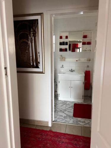 a bathroom with a sink and a white counter top at 2 Op Terblanche Guesthouse in Boksburg