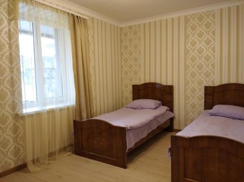 Voodi või voodid majutusasutuse Hayk B&B (in Sanahin) toas