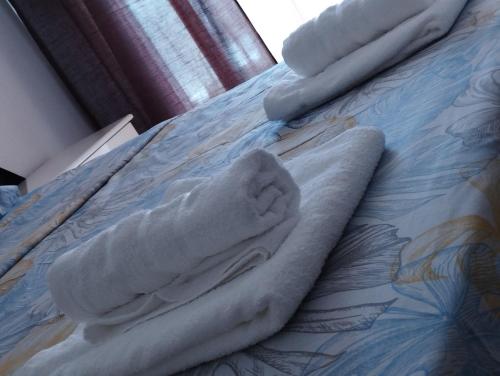 a statue of a person laying on a bed at PERIGIALI APARTMENT in Kavála