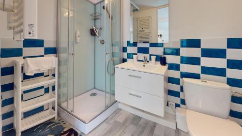 a bathroom with a shower and a toilet and a sink at Studio avec parking Rue de la Semm in Colmar