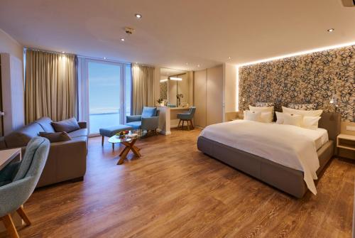 En eller flere senge i et værelse på Badhotel Sternhagen