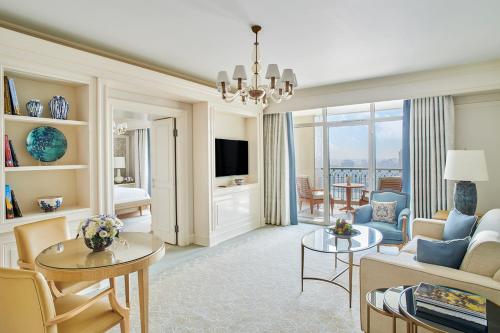 a living room with a couch and a table at Four Seasons Hotel Cairo at Nile Plaza in Cairo