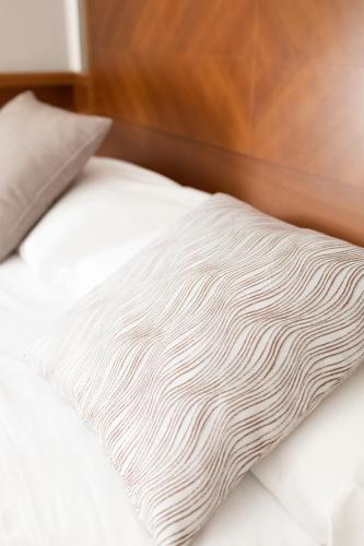 Letto o letti in una camera di Hotel Le Palme