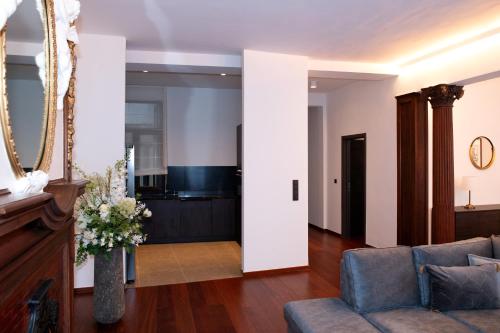 a living room with a couch and a table at Botanique Suites AirBnB, Antwerp in Antwerp