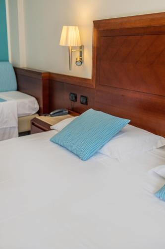 Letto o letti in una camera di Hotel Le Palme