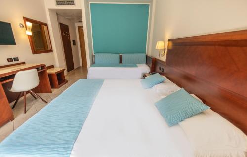 Letto o letti in una camera di Hotel Le Palme