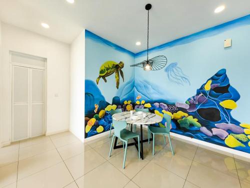 a dining room with a fish mural on the wall at D'Pristine Theme Suite by Nest Home at LEGOLAND in Nusajaya