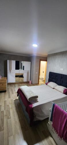 a large bedroom with a large bed in it at Baris Mah, Kardelen Sk. BekTek Sit, N.12 B1 K.12 D.24 Beylikduzu/istanbul 34520 Turkey in Beylikduzu