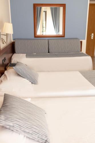 Letto o letti in una camera di Hotel Le Palme
