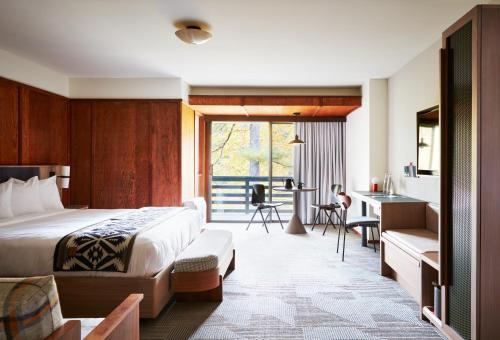 a hotel room with a bed and a desk at Skyline Lodge in Highlands