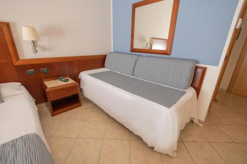 Letto o letti in una camera di Hotel Le Palme