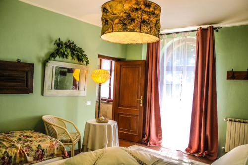 Ένα ή περισσότερα κρεβάτια σε δωμάτιο στο Agriturismo Dandelion