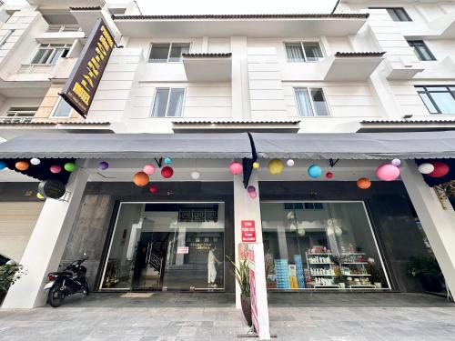 a store front of a building with balloons in front at Tuần Châu - Phương Đông Motel Hạ Long in Ha Long