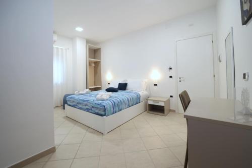 a bedroom with a bed and a desk in it at A casa di Angela B&B in Praia a Mare